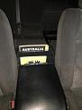 Document holder from the front between the seats